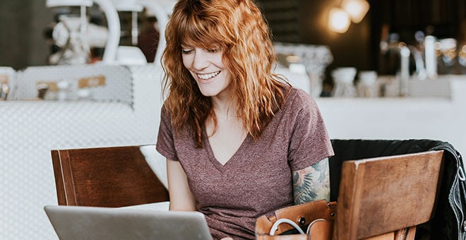 woman at computer smiling